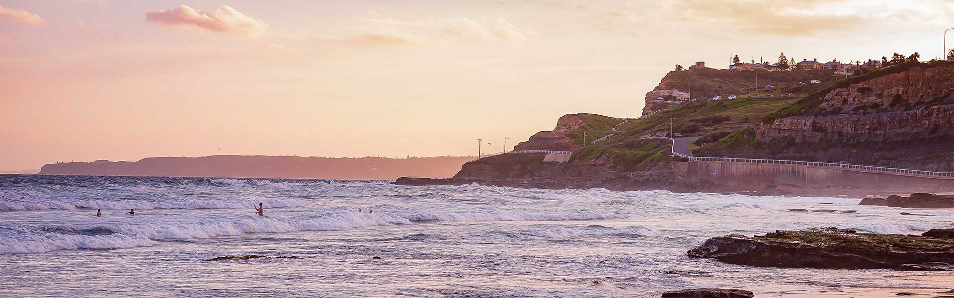 Surfers at Newcastle Beach, NSW