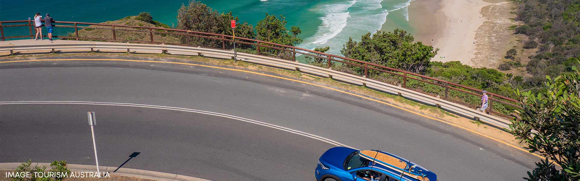 Small SUV rental car driving along NSW coast